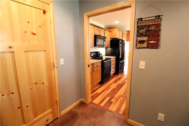 4315 Hector Dam Rd, Shell Lake, WI 54871 - kitchen featuring black appliances, baseboards, and tile patterned flooring