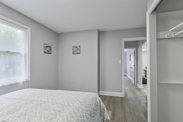71 Menomonee St, Williams Bay, WI 53191 - bedroom featuring wood finished floors, multiple windows, and baseboards