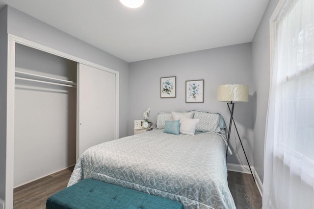 71 Menomonee St, Williams Bay, WI 53191 - bedroom featuring wood finished floors, a closet, and baseboards