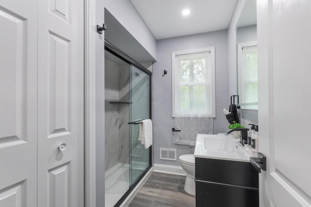 71 Menomonee St, Williams Bay, WI 53191 - bathroom with toilet, a marble finish shower, vanity, and wood finished floors