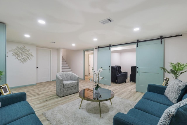 71 Menomonee St, Williams Bay, WI 53191 - living area with a barn door, stairs, light wood-style flooring, recessed lighting, and baseboards