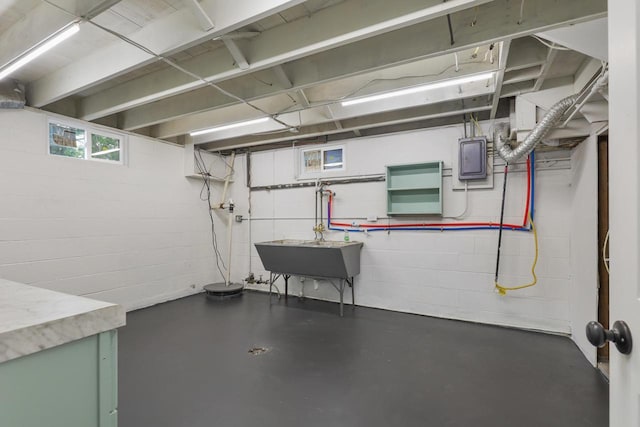 71 Menomonee St, Williams Bay, WI 53191 - below grade area featuring a sink, concrete block wall, and electric panel