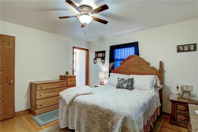 616 E Polk Ave, Eau Claire, WI 54701 - bedroom with wood finished floors, baseboards, and ceiling fan