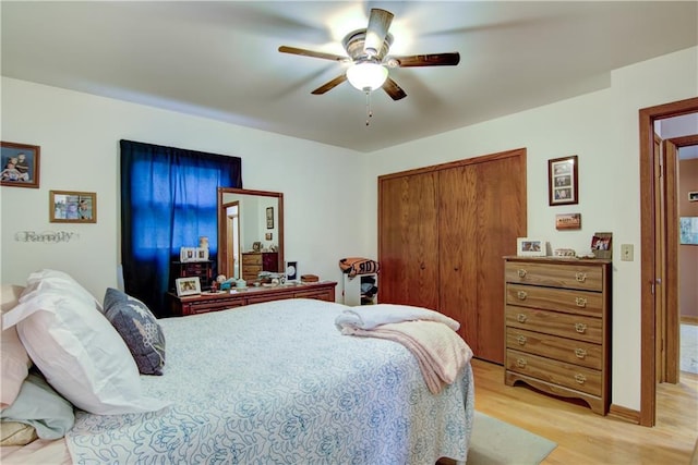 616 E Polk Ave, Eau Claire, WI 54701 - bedroom with light wood-style floors, a closet, a ceiling fan, and baseboards