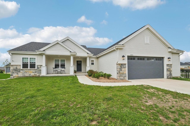 6655 Royal View Dr, Windsor, WI 53532 - craftsman house with stone siding, driveway, covered porch, and a front yard