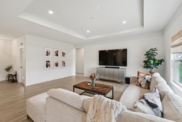 6655 Royal View Dr, Windsor, WI 53532 - living area with a tray ceiling, light wood-style floors, and recessed lighting