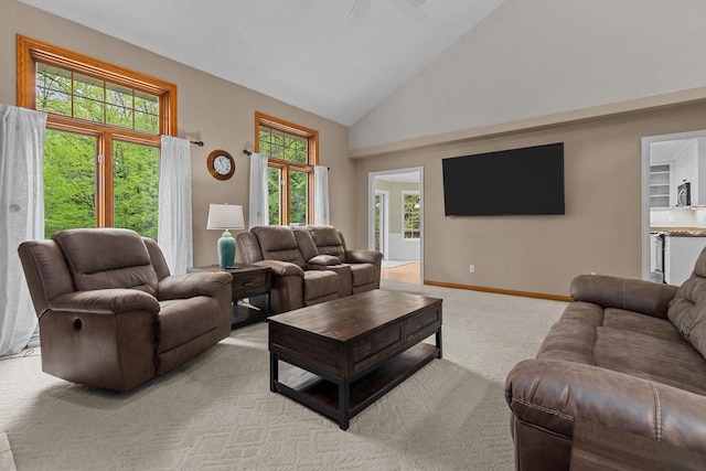 3196 Hidden Pond Rd, Green Bay, WI 54313 - living room with high vaulted ceiling, light colored carpet, ceiling fan, and baseboards