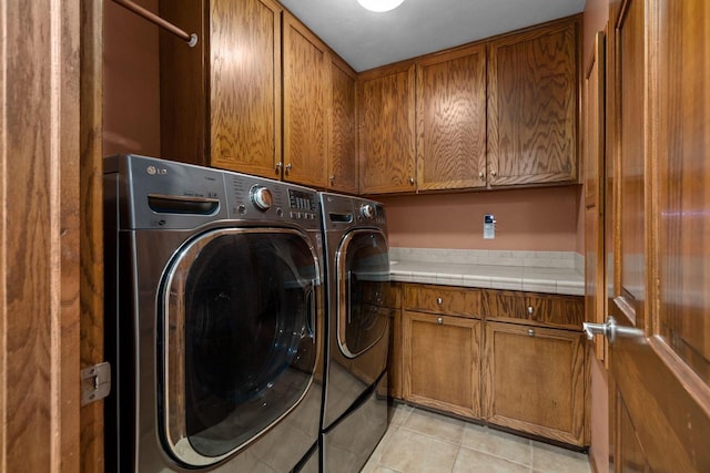 3196 Hidden Pond Rd, Green Bay, WI 54313 - laundry area featuring cabinet space, washing machine and clothes dryer, and light tile patterned floors