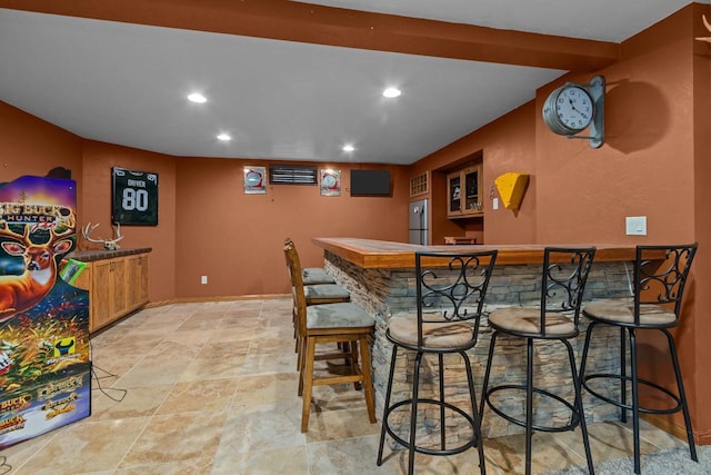 3196 Hidden Pond Rd, Green Bay, WI 54313 - indoor bar with stainless steel refrigerator, recessed lighting, light stone finish floors, and baseboards