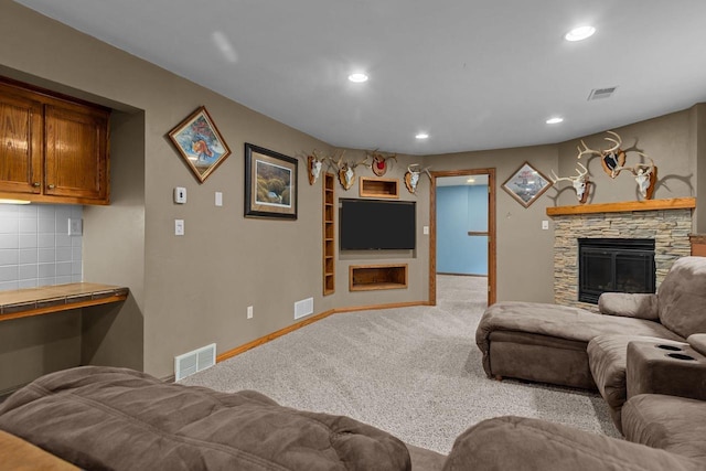3196 Hidden Pond Rd, Green Bay, WI 54313 - living area with a fireplace, light colored carpet, baseboards, recessed lighting, and built in shelves