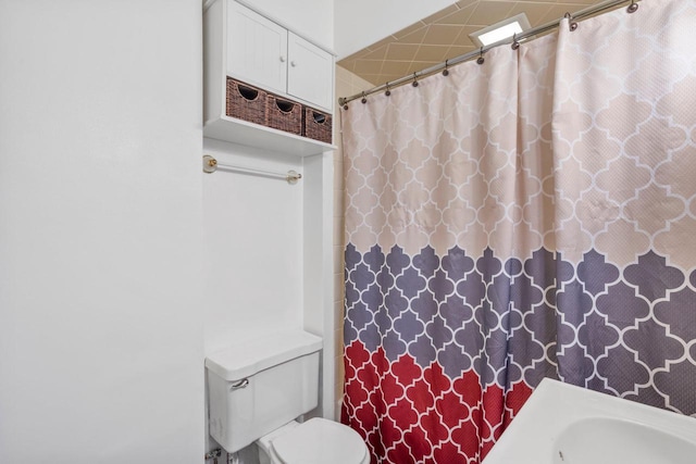 5432 25th Ave, Kenosha, WI 53140 - bathroom with toilet, a shower with curtain, and a sink