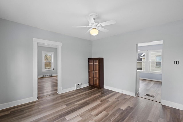 5432 25th Ave, Kenosha, WI 53140 - unfurnished bedroom with wood finished floors, baseboards, and ceiling fan