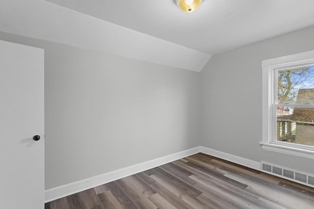 5432 25th Ave, Kenosha, WI 53140 - bonus room with vaulted ceiling, dark wood finished floors, and baseboards