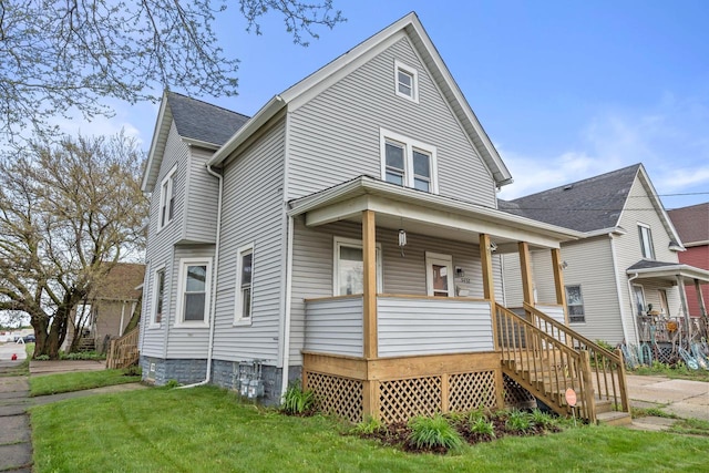 5432 25th Ave, Kenosha, WI 53140 - view of front facade featuring a porch, a front yard, and stairway