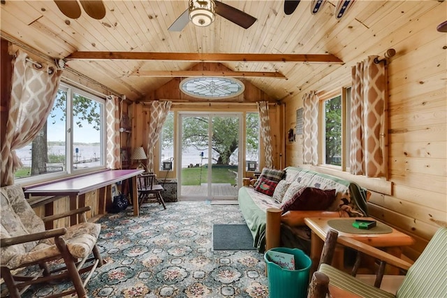 630 W Lake Dr, Shell Lake, WI 54871 - living room featuring a ceiling fan, wooden ceiling, wood walls, a water view, and carpet floors