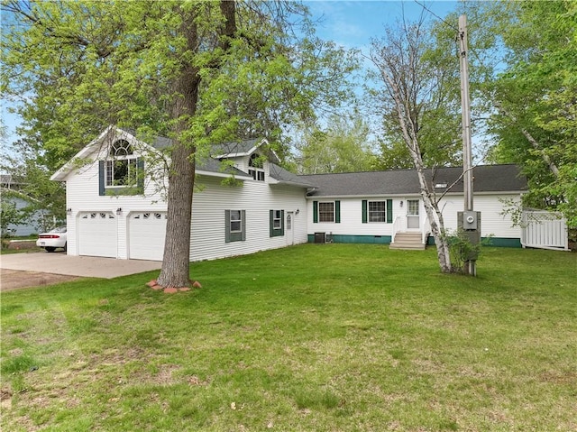 630 W Lake Dr, Shell Lake, WI 54871 - view of front of property featuring concrete driveway, a front yard, entry steps, central AC unit, and an attached garage