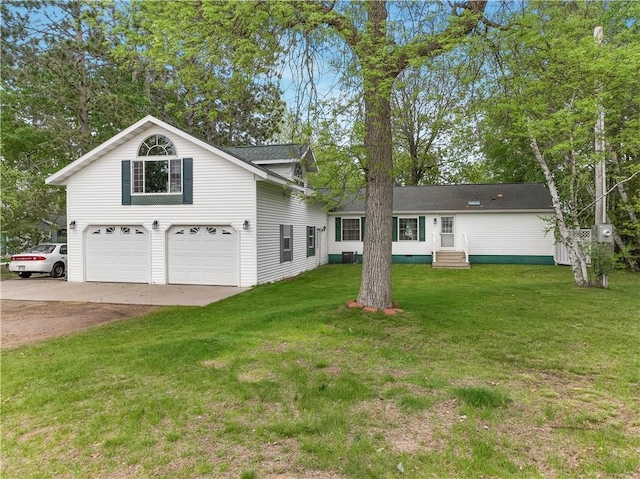 630 W Lake Dr, Shell Lake, WI 54871 - view of front facade featuring driveway, a front lawn, and a garage