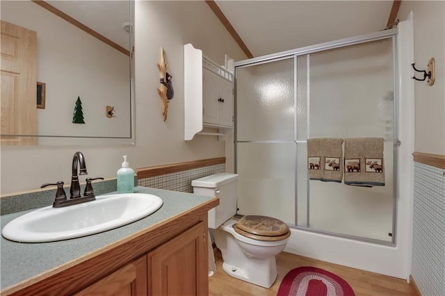 630 W Lake Dr, Shell Lake, WI 54871 - full bath featuring a shower with shower door, toilet, vanity, crown molding, and wood finished floors