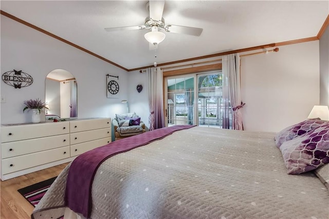 630 W Lake Dr, Shell Lake, WI 54871 - bedroom with ornamental molding, lofted ceiling, wood finished floors, arched walkways, and ceiling fan