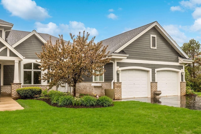 845 Lake Rd Unit D, Brookfield, WI 53005 - craftsman-style home with a front yard, driveway, and roof with shingles