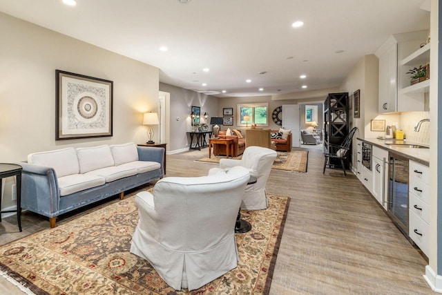 845 Lake Rd Unit D, Brookfield, WI 53005 - living area featuring recessed lighting, beverage cooler, bar, and baseboards