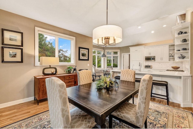 845 Lake Rd Unit D, Brookfield, WI 53005 - dining area featuring light wood-style floors, baseboards, and recessed lighting