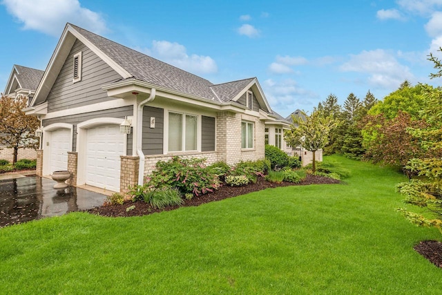 845 Lake Rd Unit D, Brookfield, WI 53005 - view of property exterior featuring a shingled roof, a lawn, driveway, and brick siding