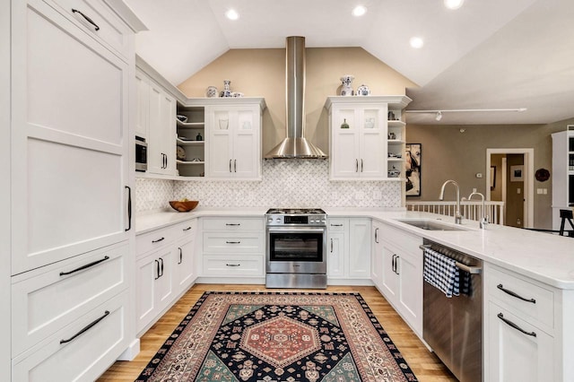 845 Lake Rd Unit D, Brookfield, WI 53005 - kitchen with open shelves, stainless steel appliances, a sink, wall chimney exhaust hood, and a peninsula