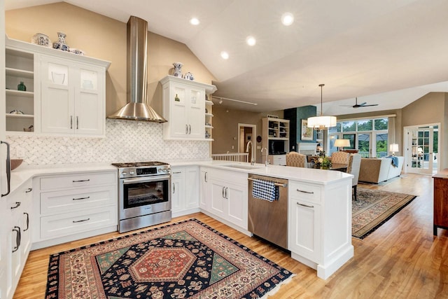 845 Lake Rd Unit D, Brookfield, WI 53005 - kitchen with stainless steel appliances, open shelves, wall chimney exhaust hood, a peninsula, and a sink