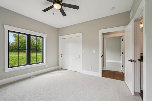 N67W27095 Fanad Dr, Lisbon, WI 53089 - unfurnished bedroom featuring carpet flooring, baseboards, ceiling fan, and a closet