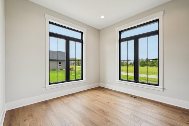 N67W27095 Fanad Dr, Lisbon, WI 53089 - spare room featuring baseboards, wood finished floors, and recessed lighting