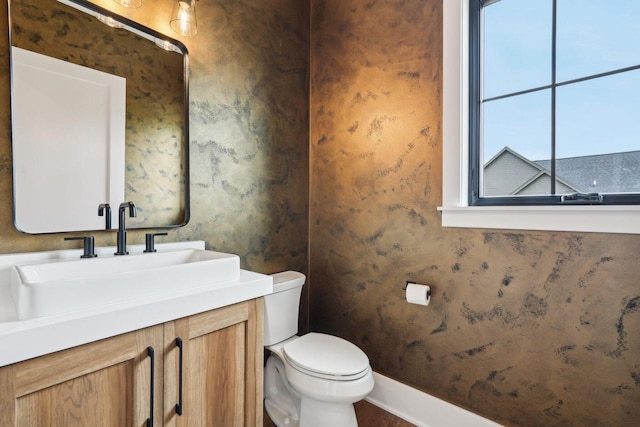 N67W27095 Fanad Dr, Lisbon, WI 53089 - bathroom featuring toilet, vanity, and baseboards