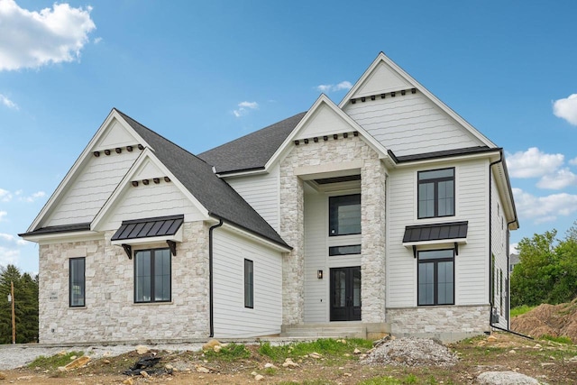 N67W27095 Fanad Dr, Lisbon, WI 53089 - view of front of house with stone siding and roof with shingles