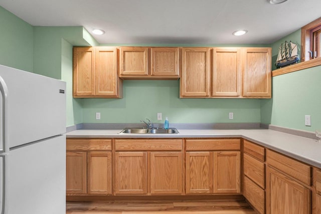 517 Brule Pkwy, Deforest, WI 53532 - kitchen with freestanding refrigerator, a sink, light countertops, light wood finished floors, and recessed lighting