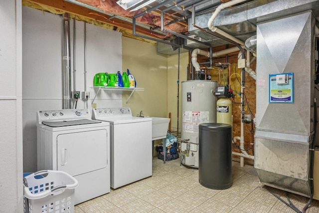 517 Brule Pkwy, Deforest, WI 53532 - washroom featuring washer and clothes dryer, gas water heater, and heating unit