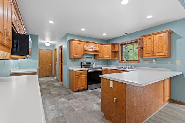 1394 Wellington Dr, Suamico, WI 54173 - kitchen with stainless steel electric range oven, a peninsula, a sink, light countertops, and recessed lighting