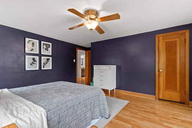 144 Lau St, Green Bay, WI 54302 - bedroom with light wood-type flooring, baseboards, and a ceiling fan
