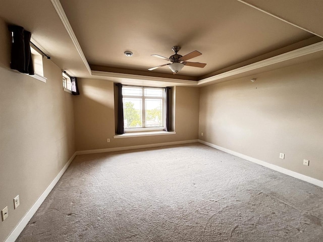 1021 W Pleasant St Unit 5, Portage, WI 53901 - empty room with a tray ceiling, a ceiling fan, carpet, and baseboards