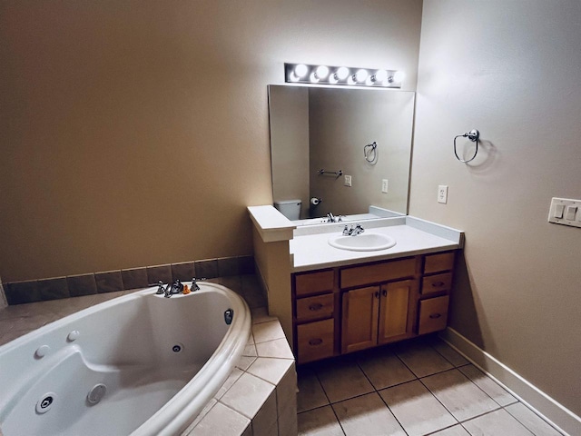 1021 W Pleasant St Unit 5, Portage, WI 53901 - bathroom with a tub with jets, vanity, tile patterned floors, and baseboards