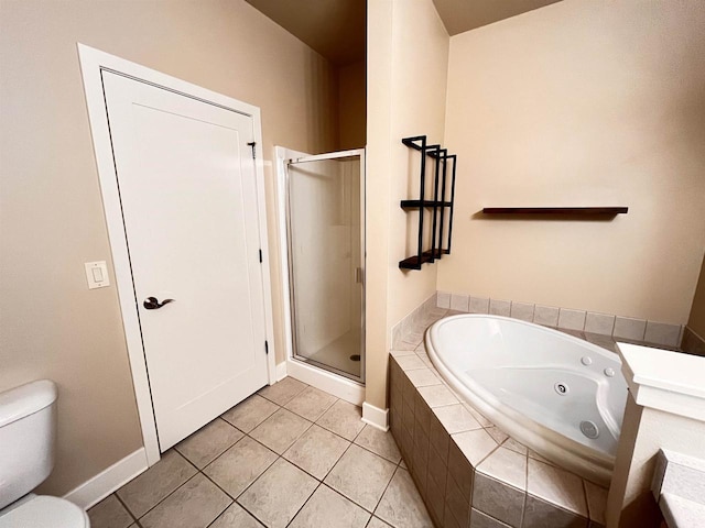 1021 W Pleasant St Unit 5, Portage, WI 53901 - bathroom featuring a tub with jets, a shower stall, tile patterned flooring, toilet, and baseboards