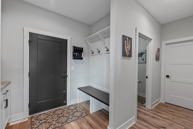 6340 Congress Dr, West Bend, WI 53095 - mudroom featuring wood finished floors and baseboards