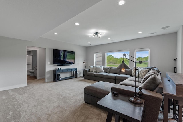 6340 Congress Dr, West Bend, WI 53095 - living area with recessed lighting, light colored carpet, and baseboards