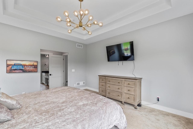 6340 Congress Dr, West Bend, WI 53095 - carpeted bedroom featuring a tray ceiling, a chandelier, and baseboards