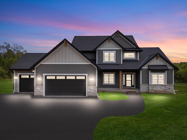 6340 Congress Dr, West Bend, WI 53095 - view of front facade featuring stone siding, board and batten siding, and roof with shingles
