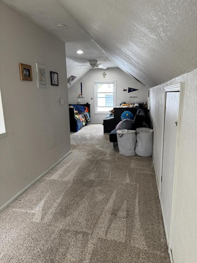 2775 S 53rd St, Milwaukee, WI 53219 - bonus room featuring carpet floors, lofted ceiling, a textured ceiling, baseboards, and a ceiling fan