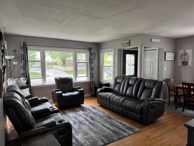 2775 S 53rd St, Milwaukee, WI 53219 - living area featuring wood finished floors, ornate columns, and baseboards