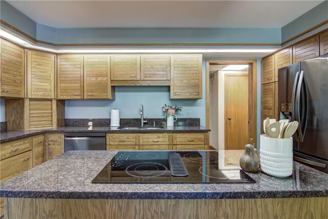 3904 Forest Heights Dr, Eau Claire, WI 54701 - kitchen with a sink, stainless steel appliances, and dark stone countertops