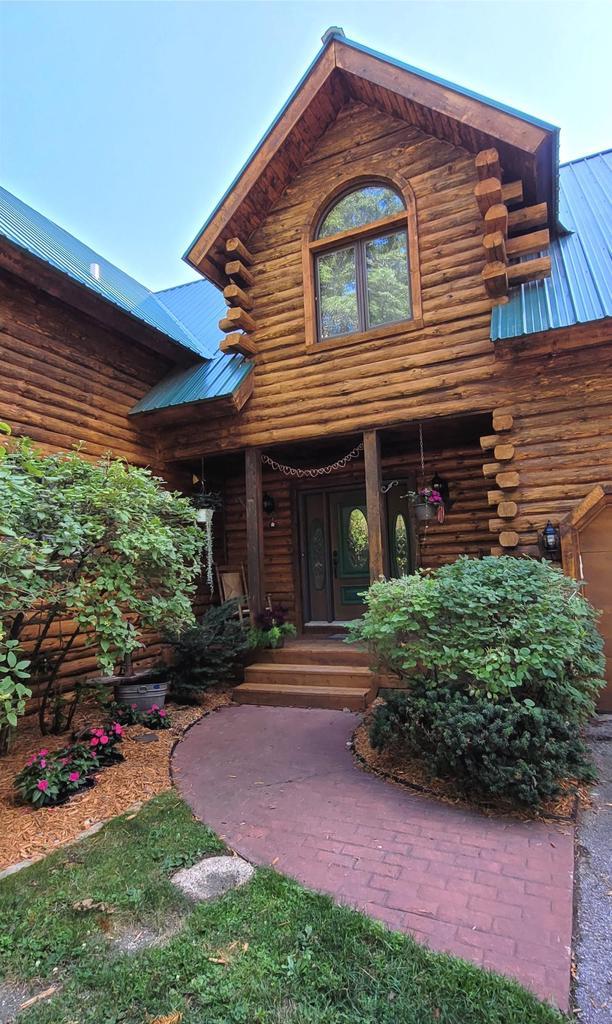 W6887 Two Mile Rd, Porterfield, WI 54159 - doorway to property with log siding