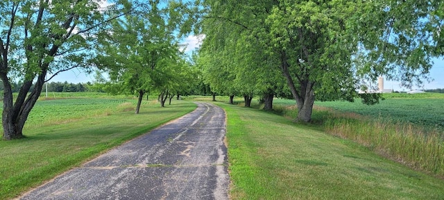 W6887 Two Mile Rd, Porterfield, WI 54159 - view of home's community with a yard and asphalt driveway