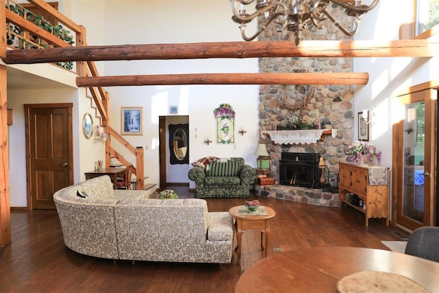 W6887 Two Mile Rd, Porterfield, WI 54159 - living room with a chandelier, a towering ceiling, hardwood / wood-style floors, stairs, and a stone fireplace